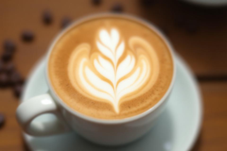 Artistic latte art with fern leaf design
